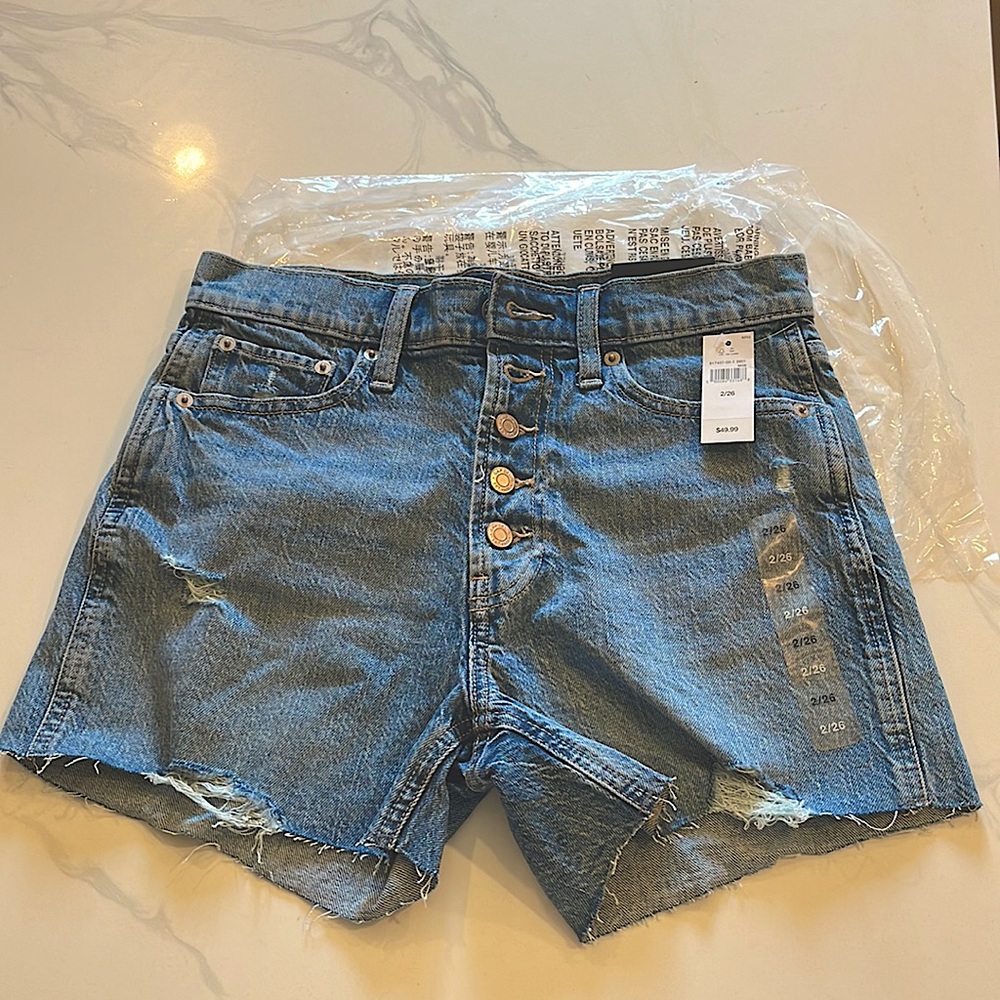 NWT GAP denim shorts with button closure.